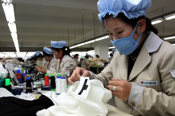 employees work at the assembly line of the factory of South Korean company 