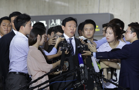 Shin Dong-Bin speaks with the media as he arrives from Japan at Gimpo airport on August 3, 2015 in Seoul, South Korea. 