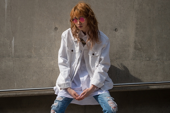 A woman poses for photographers outside the Wednesday’s Seoul Fashion Week festivities.