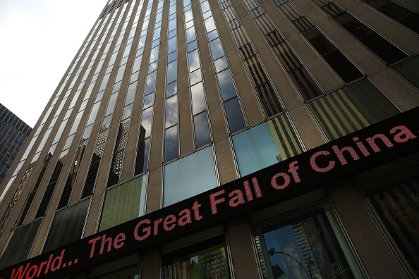 A news ticker is seen in midtown Manhattan on August 24, 2015 in New York City. As the global economy continues to react from events in China, markets dropped significantly around the world on Monday.