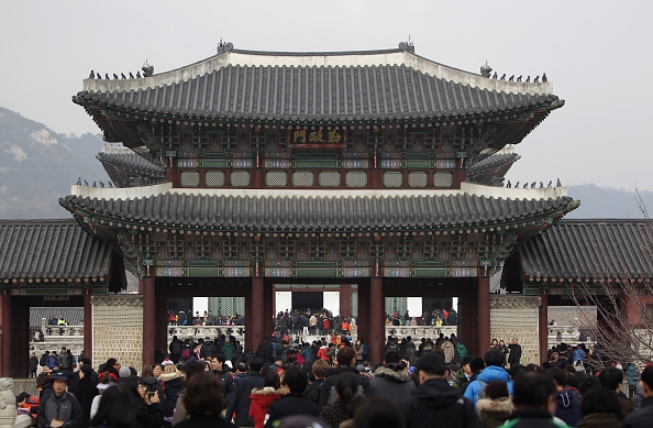People enjoy the celebrations during a Lunar New Year day at Gyeongbokgung royal palace on February 19, 2015 in Seoul, South Korea.